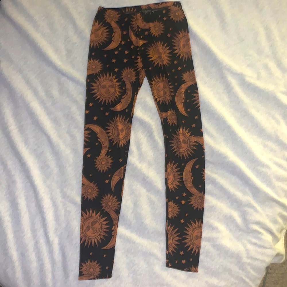See You Monday leggings with a Sun, moon, and star pattern.